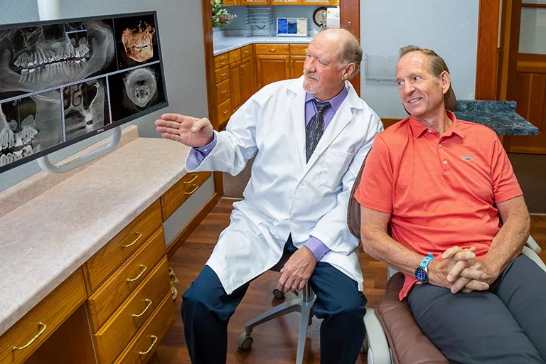 Dr. Herndon in a consultation with a patient.